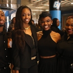 Black student graduates smiling